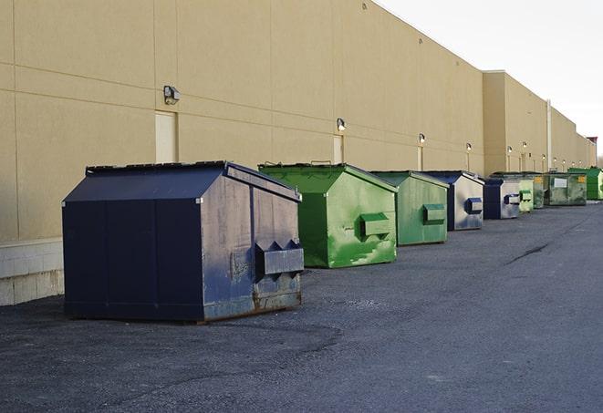 red and green waste bins at a building project in Hemlock, MI